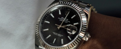 Steel Rolex Datejust 41 with fluted bezel, black dial and jubilee bracelet, on the wrist