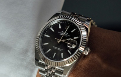 Steel Rolex Datejust 41 with fluted bezel, black dial and jubilee bracelet, on the wrist