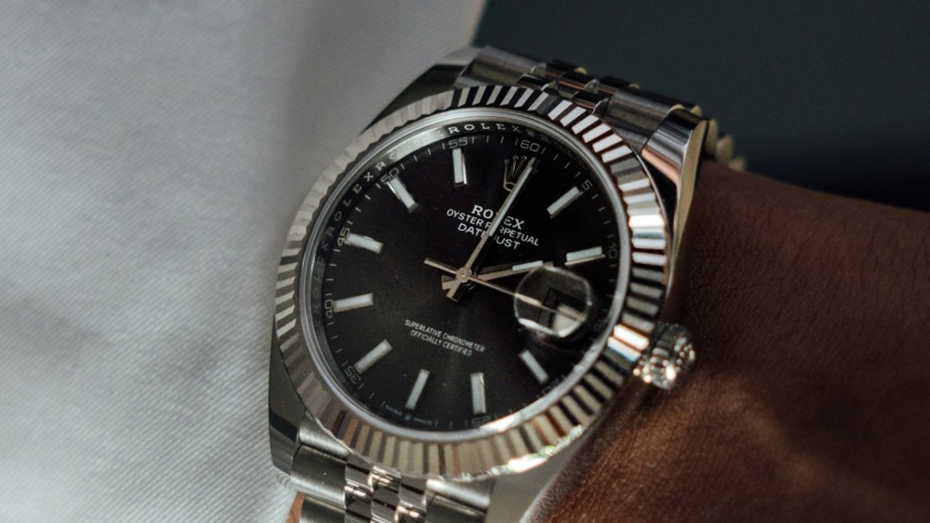 Steel Rolex Datejust 41 with fluted bezel, black dial and jubilee bracelet, on the wrist