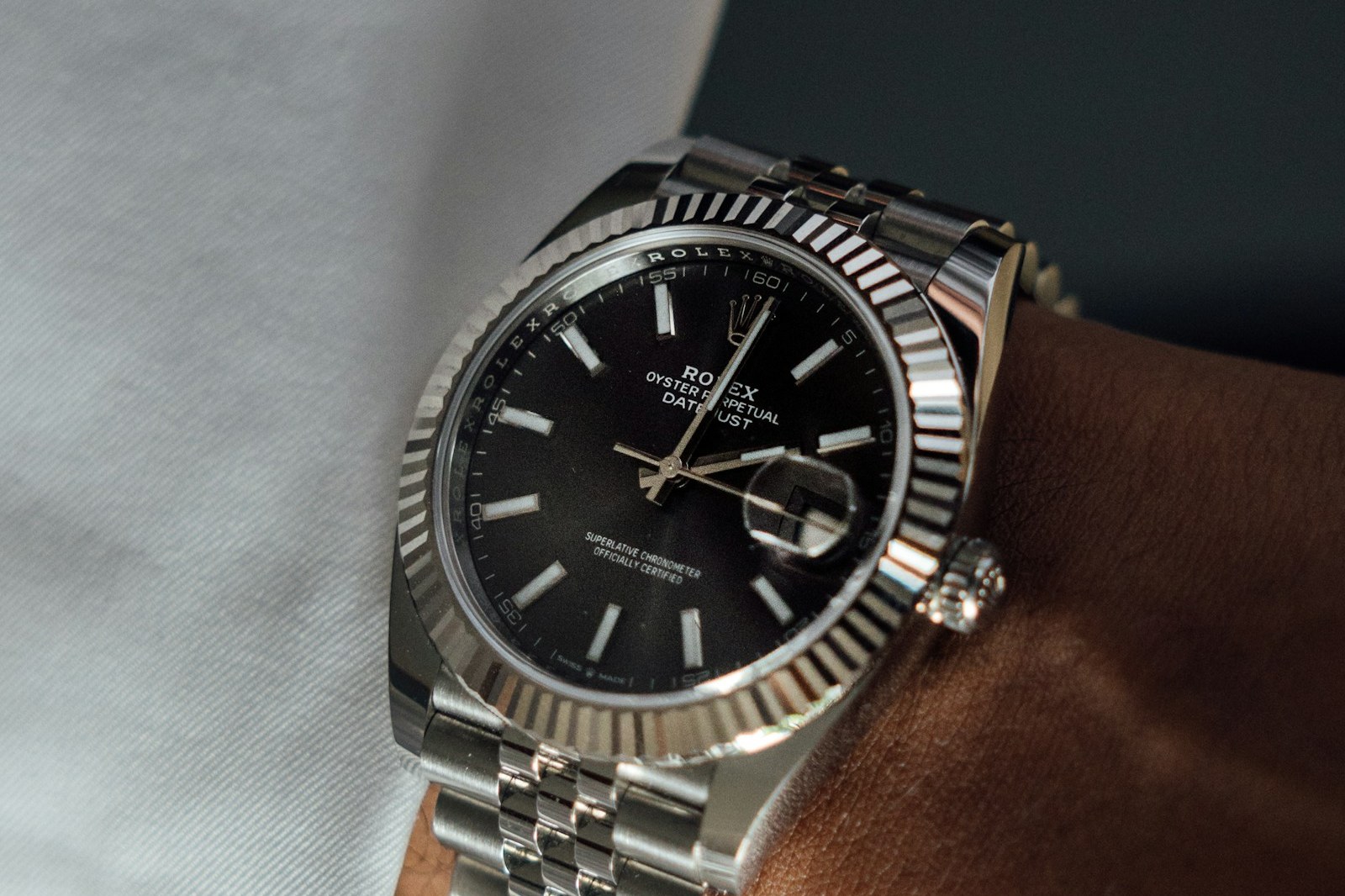 Steel Rolex Datejust 41 with fluted bezel, black dial and jubilee bracelet, on the wrist