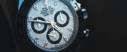 Steel Rolex Daytona with white dial, black subdials and black ceramic bezel, on the wrist