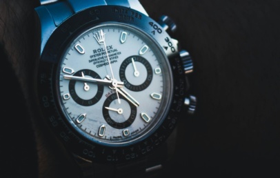 Steel Rolex Daytona with white dial, black subdials and black ceramic bezel, on the wrist