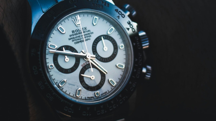 Steel Rolex Daytona with white dial, black subdials and black ceramic bezel, on the wrist